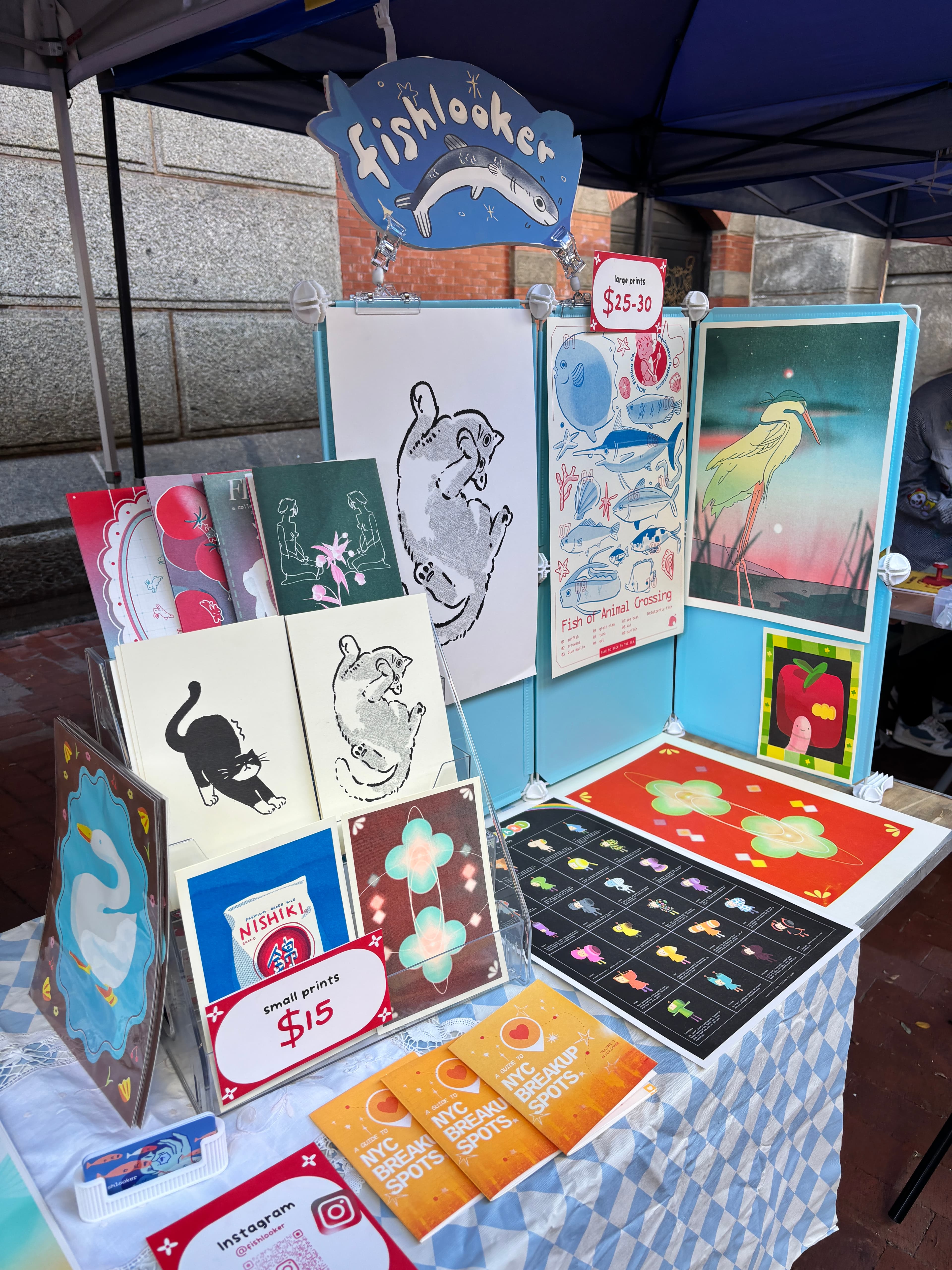 fishlooker booth of risograph prints and zines at an outdoor market